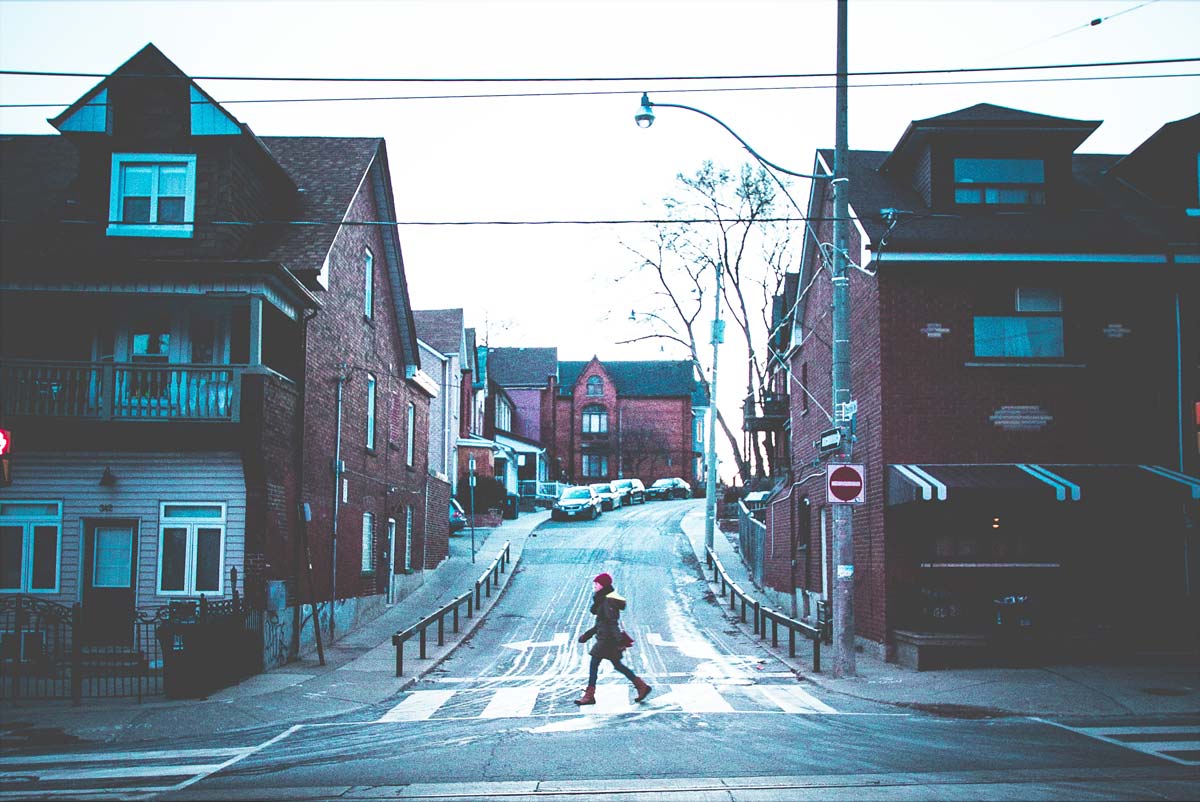 image of a person crossing a street